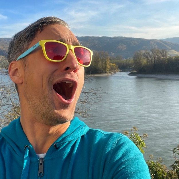 chris o'bray looking amazed at the danube river on a sunny day
